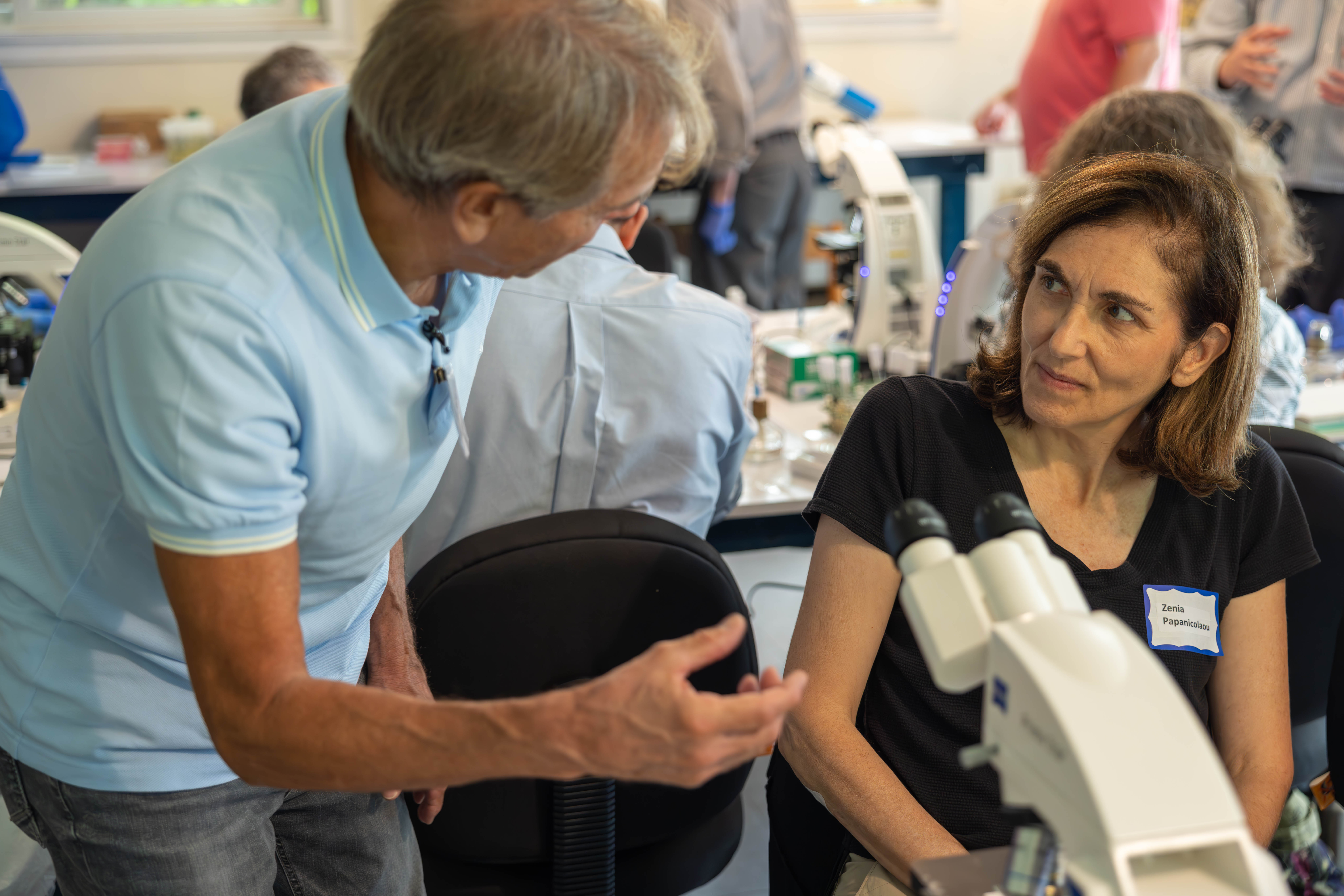 Students and Faculty working in lab.