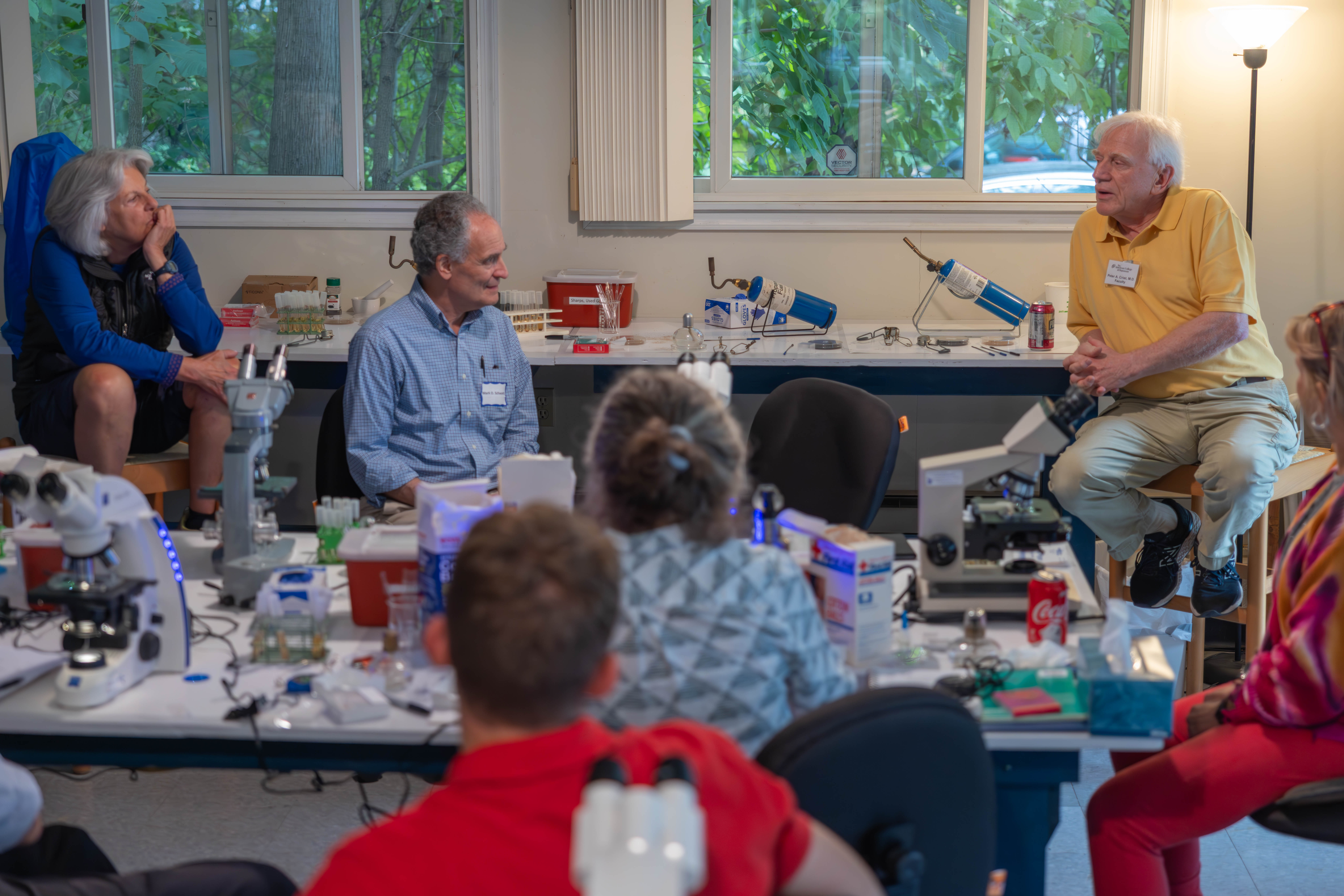 Dr. Peter Crist discussing observations with students and faculty.
